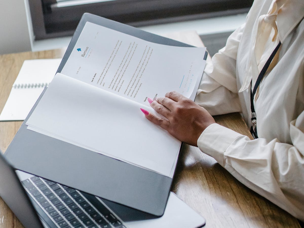 Accountant reviewing hospital financial reports on a desktop